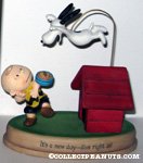 Snoopy leaping at Charlie Brown from supper Figurine