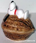 Snoopy laying on top of Walnut Nut Dish