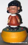 Lucy standing in mushroom patch Musicbox