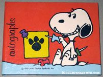 Snoopy holding push pins Autograph Book