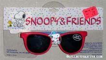 Snoopy sitting wearing hat